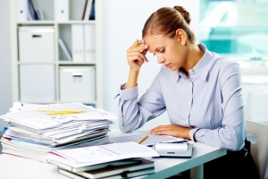 Business woman working with papers in her office