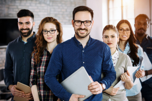 Group of employees standing in their office