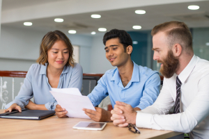 Team of office workers analyzing strategy