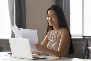 Business woman working with papers in her office