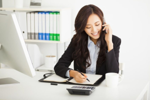Businesswoman talking to someone over the phone Businesswoman talking to someone over the phone