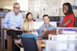 Businesspeople Having Meeting In Modern Open Plan Office