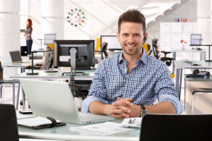 Happy casual successful caucasian business consultant at startup office, sitting at table with laptop computer, smiling, confident, looking at camera, Happy casual successful caucasian business consultant at startup office, sitting at table with laptop computer, smiling, confident, looking at camera,