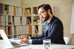 Businessman working on a laptop in his office