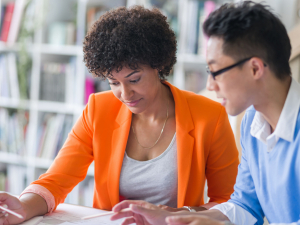 Two business people working together in an office