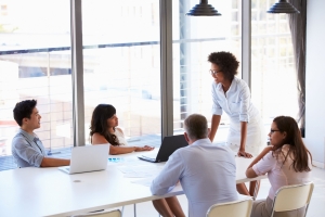 Businesswoman presenting to colleagues at a meeting