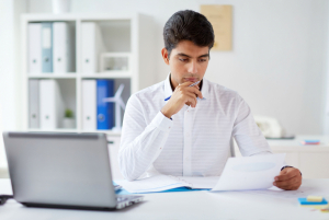 Businessman working with papers in his office