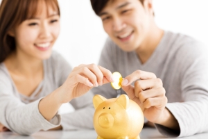 Young Couple Saving Money