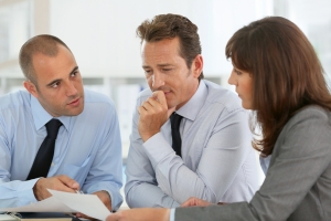 Business people reviewing a document Business people reviewing a document