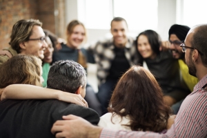 Team huddle with a group of business people