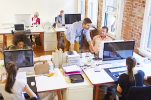 Busy office with employees working at desks